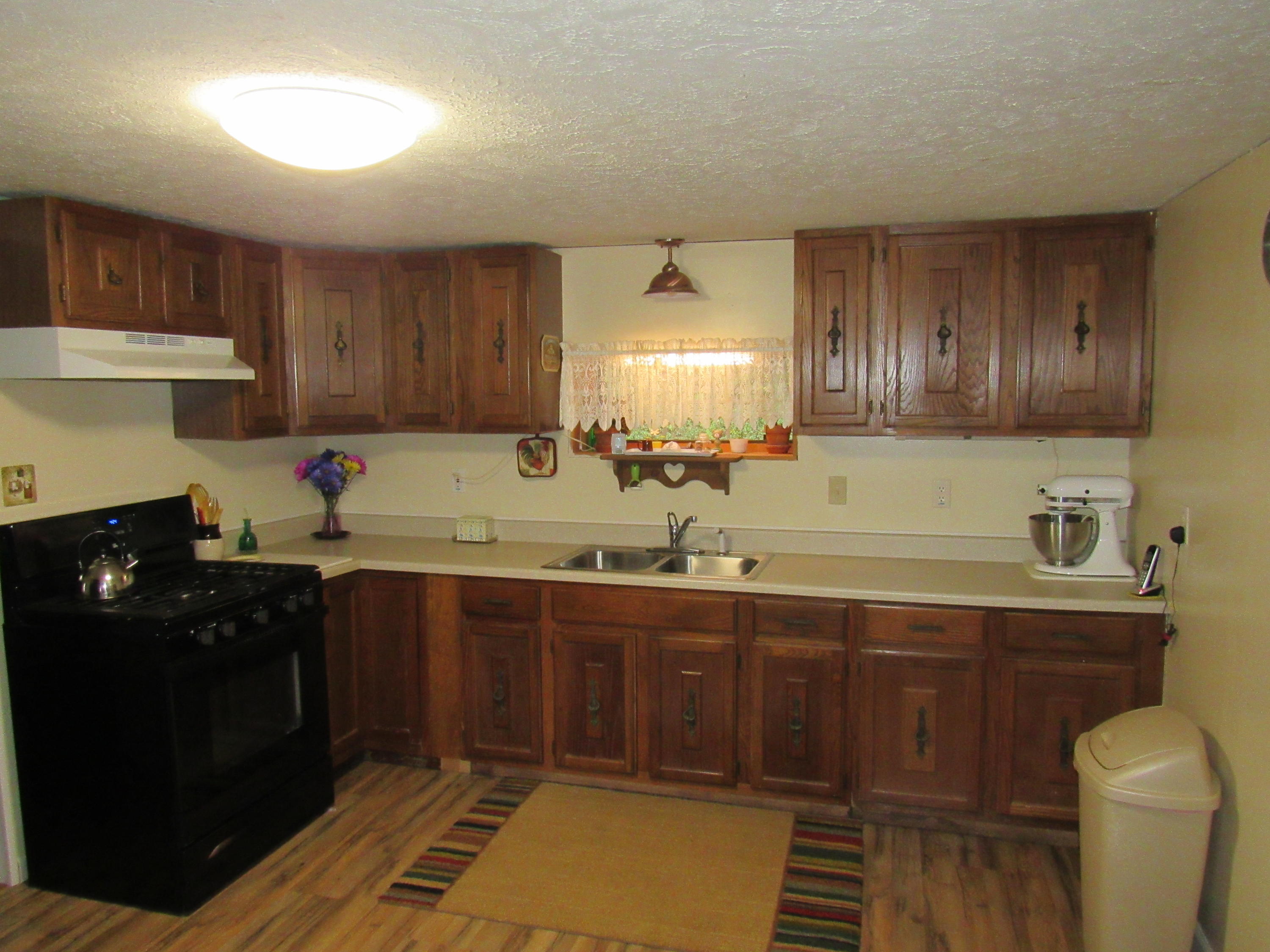 2700 Johnny's Ridge Road Ferrum, VA 24088 - Photo 7 of 32 a kitchen with a sink and cabinets