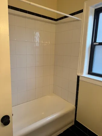 a bathroom with a shower and a bathtub