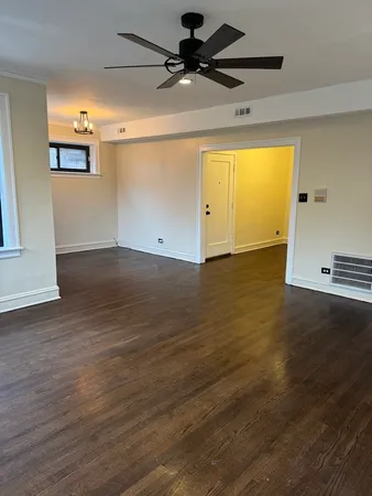 a view of a big room with wooden floor