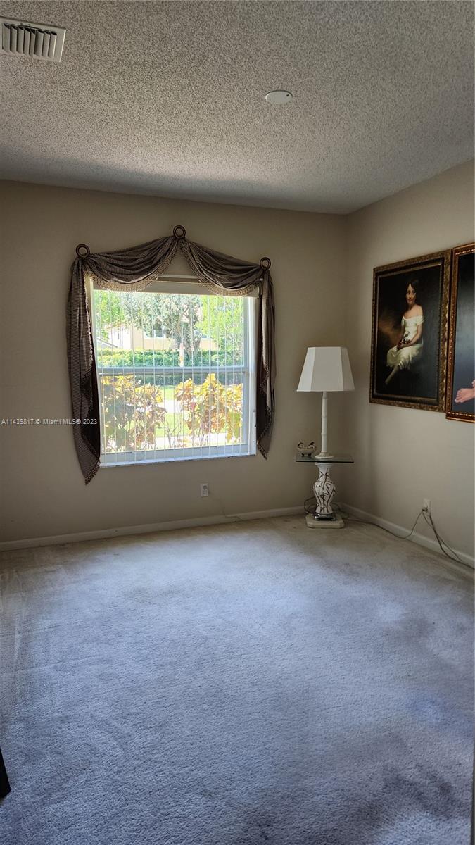 21128 Vía Solano Boca Raton, FL 33433 - Photo 11 of 25 an empty room with windows
