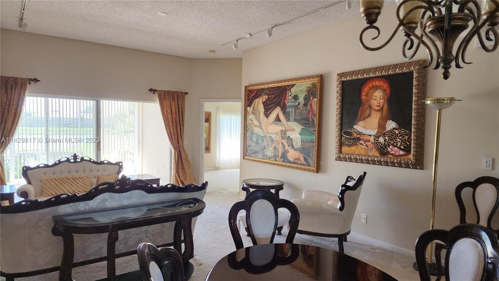 21128 Vía Solano Boca Raton, FL 33433 - Photo 18 of 25 a view of a dining room with furniture window and outside view