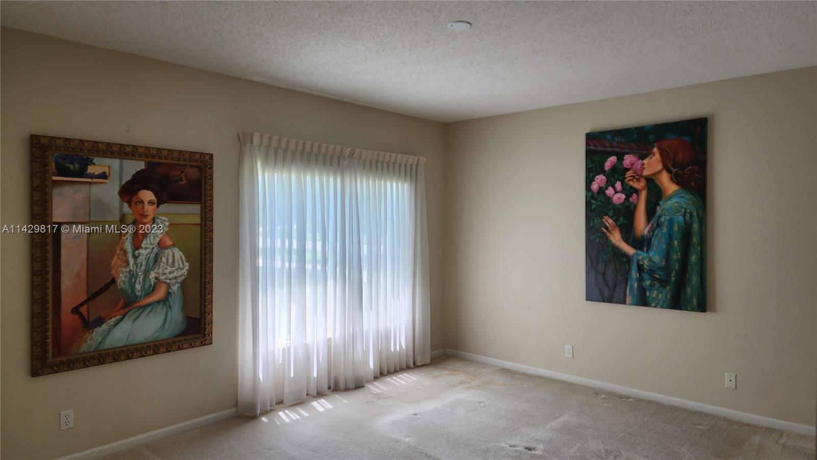 21128 Vía Solano Boca Raton, FL 33433 - Photo 22 of 25 an entryway to ceiling window and a painting on the wall