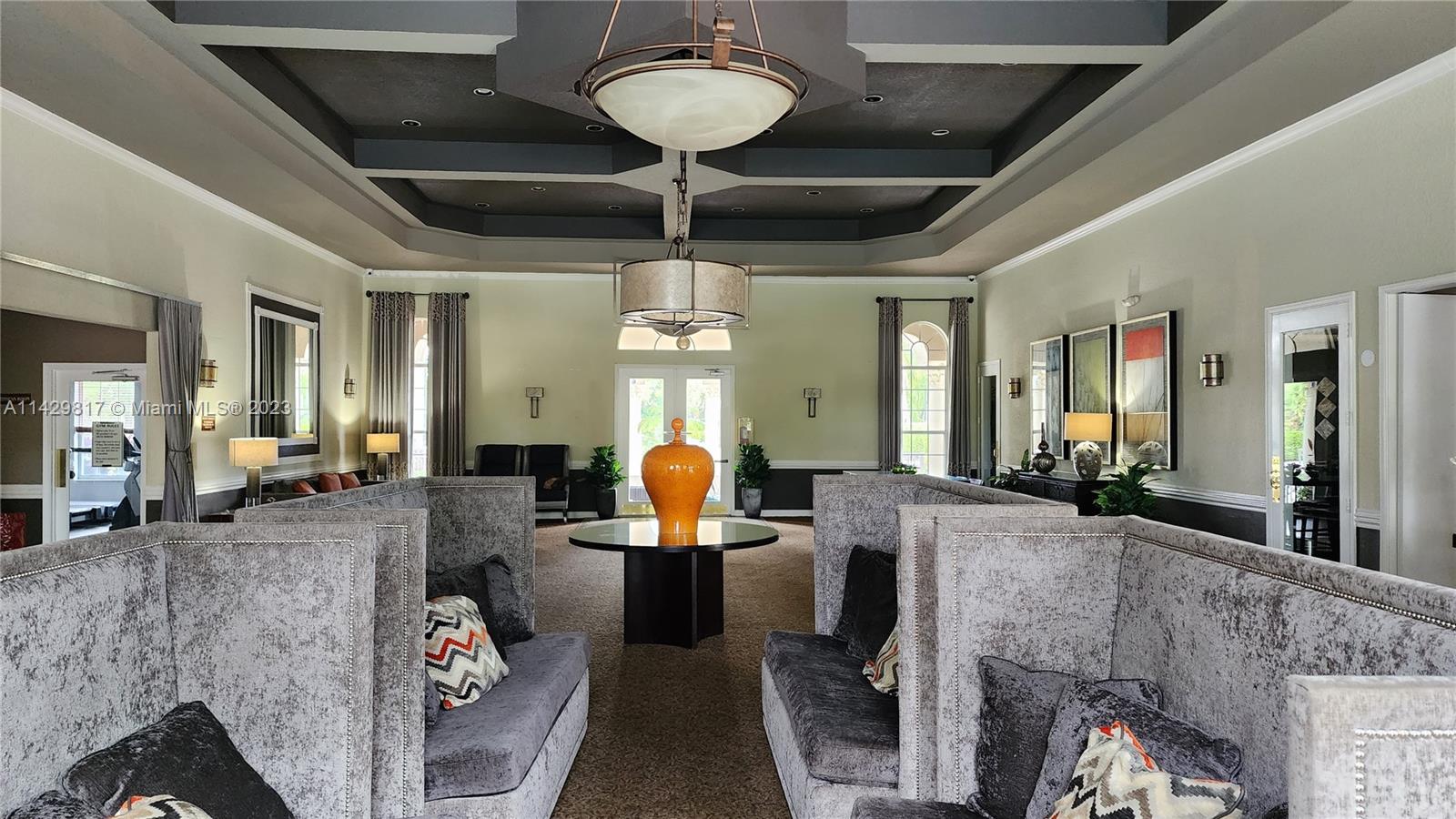 21128 Vía Solano Boca Raton, FL 33433 - Photo 6 of 25 a living room with furniture and a chandelier