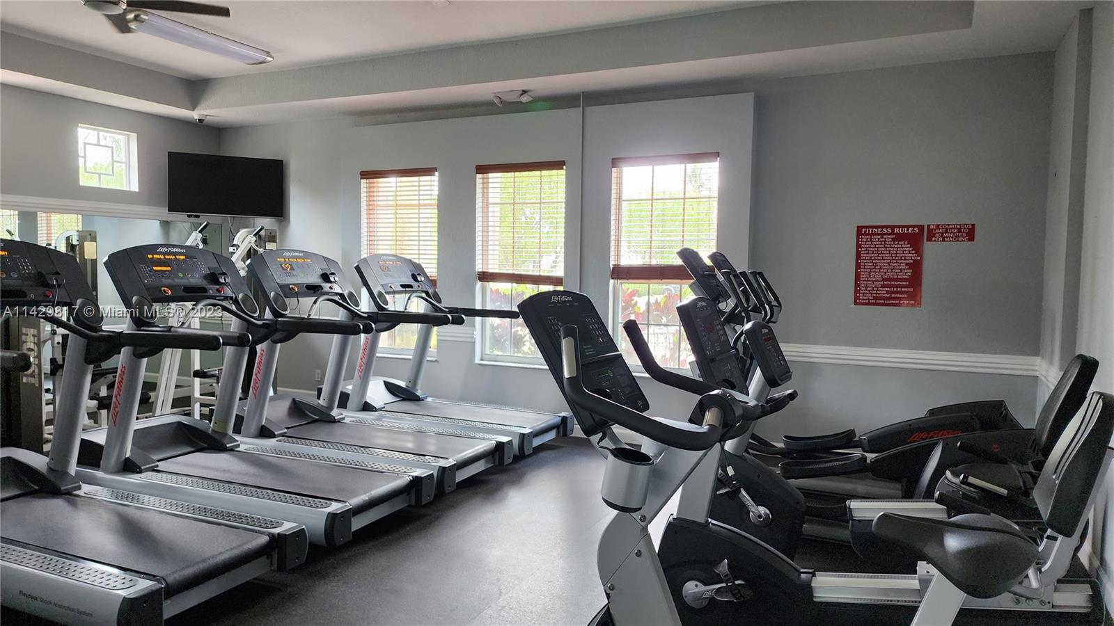 21128 Vía Solano Boca Raton, FL 33433 - Photo 7 of 25 a view of a room with gym equipment