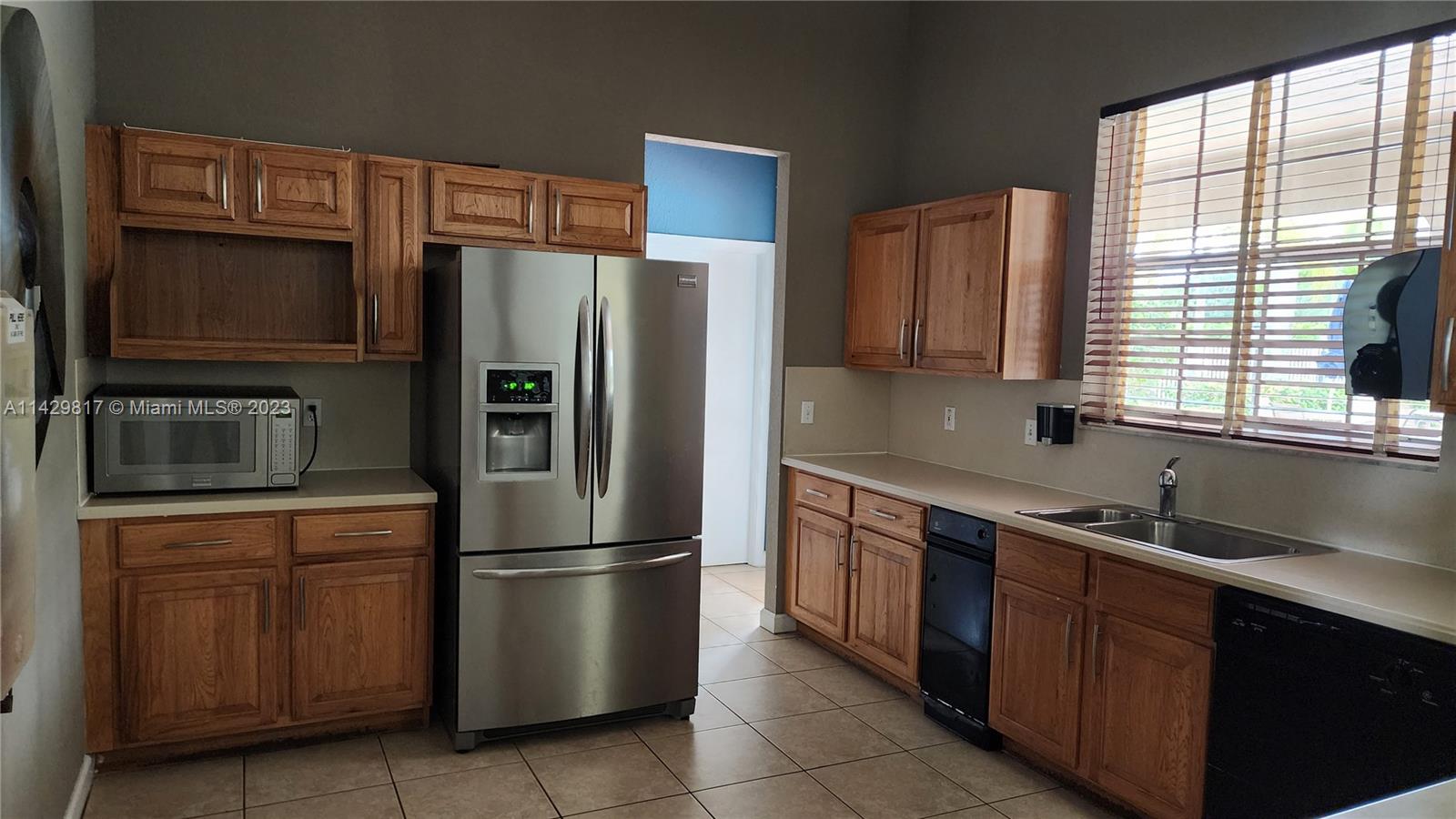 21128 Vía Solano Boca Raton, FL 33433 - Photo 8 of 25 a kitchen with stainless steel appliances granite countertop a refrigerator and a sink