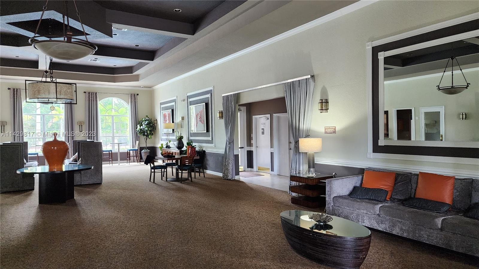 21128 Vía Solano Boca Raton, FL 33433 - Photo 10 of 25 a living room with furniture and a large window