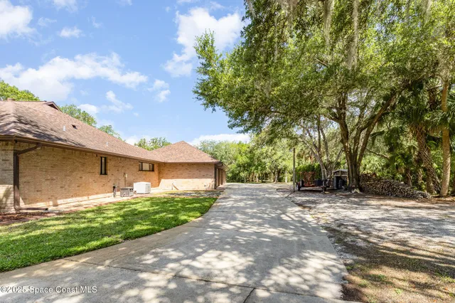 a view of a house with a yard and garage