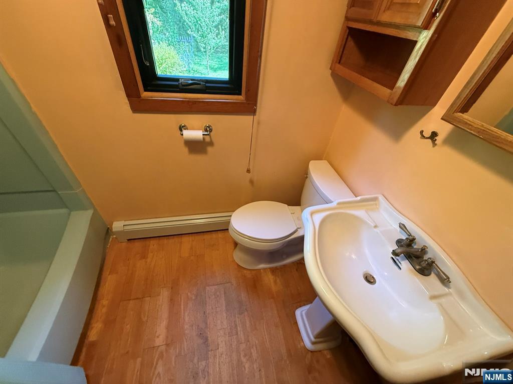 78 Woodland Road Ringwood, NJ 07456 - Photo 12 of 33 a bathroom with a toilet and a sink