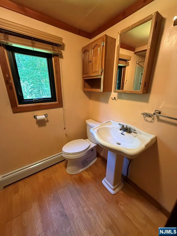 78 Woodland Road Ringwood, NJ 07456 - Photo 13 of 33 a bathroom with a sink a toilet and mirror