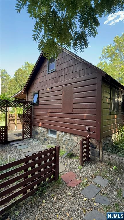 78 Woodland Road Ringwood, NJ 07456 - Photo 19 of 33 a front view of a house with garden
