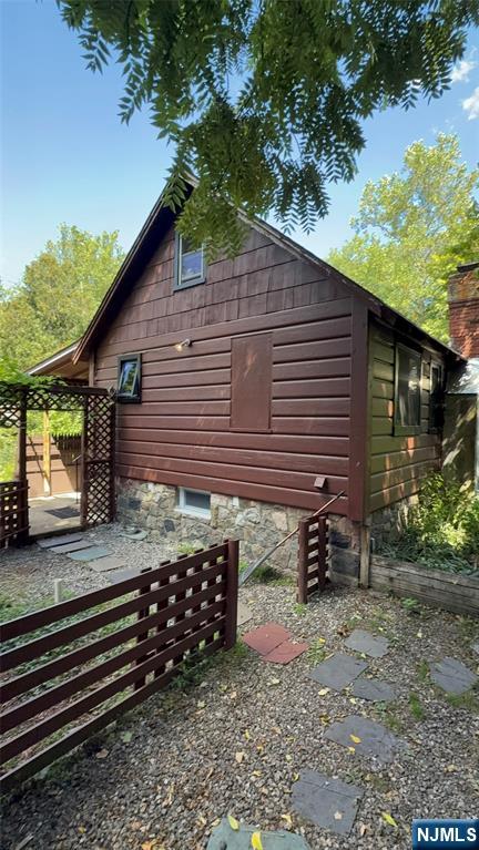 78 Woodland Road Ringwood, NJ 07456 - Photo 20 of 33 a backyard of a house with lots of green space