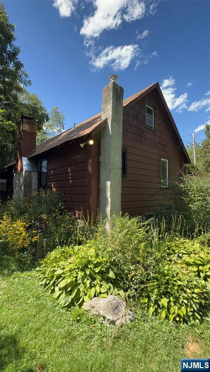 78 Woodland Road Ringwood, NJ 07456 - Photo 21 of 33 a front view of a house with garden