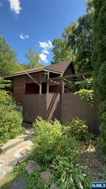 78 Woodland Road Ringwood, NJ 07456 - Photo 27 of 33 a backyard of a house with lots of green space