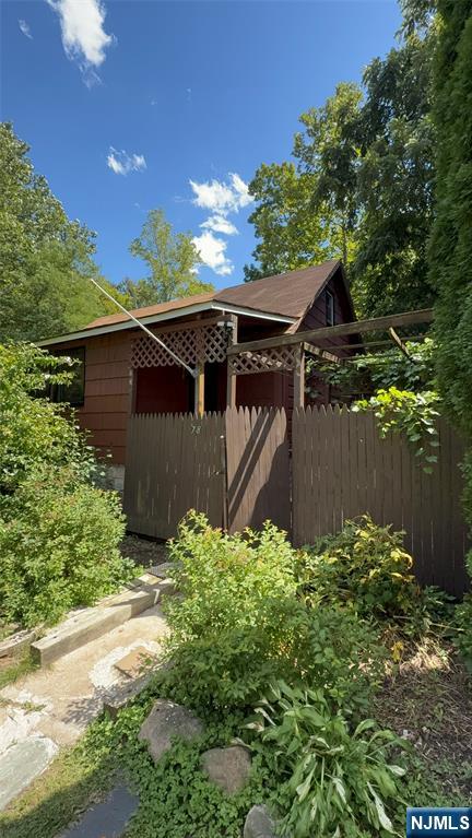 78 Woodland Road Ringwood, NJ 07456 - Photo 28 of 33 a view of a backyard with plants
