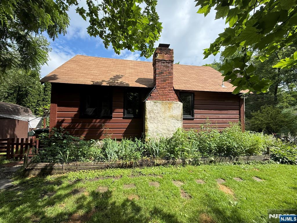 78 Woodland Road Ringwood, NJ 07456 - Photo 4 of 33 a view of house with a yard