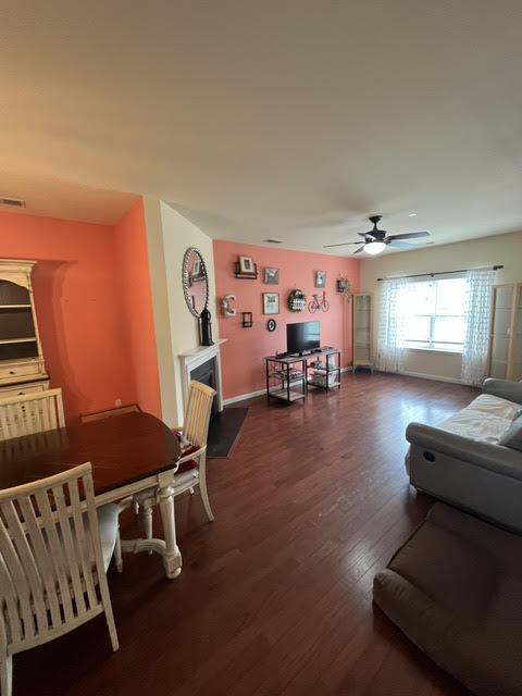 2212 Rising Hill Road Whitehall, PA 18052 - Photo 8 of 21 Hardwood floors flow through this welcoming living and dining space, illuminated by natural light from ample windows.