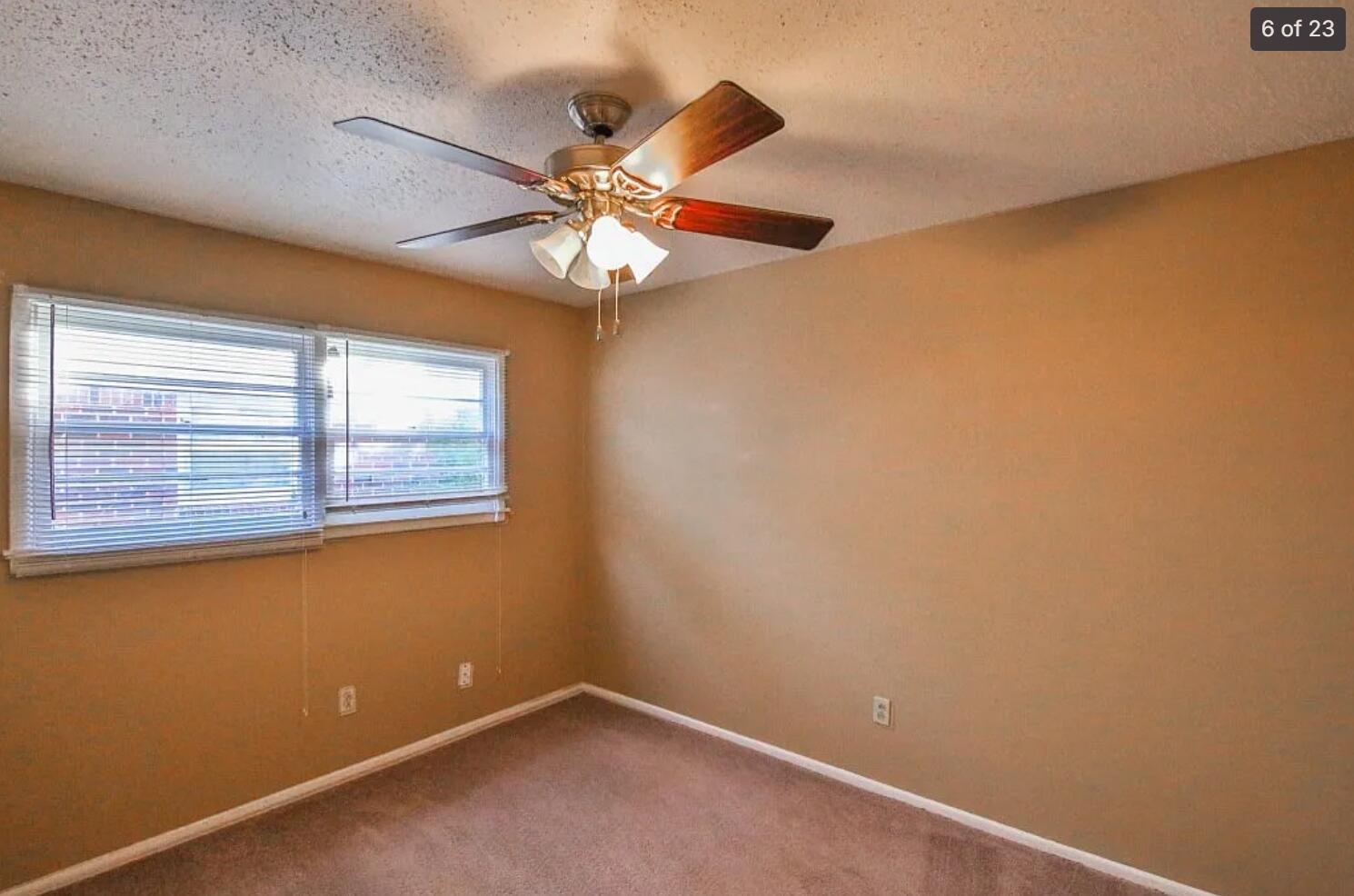 5426 33rd Street Lubbock, TX 79407 - Photo 12 of 27 an empty room with windows and fan