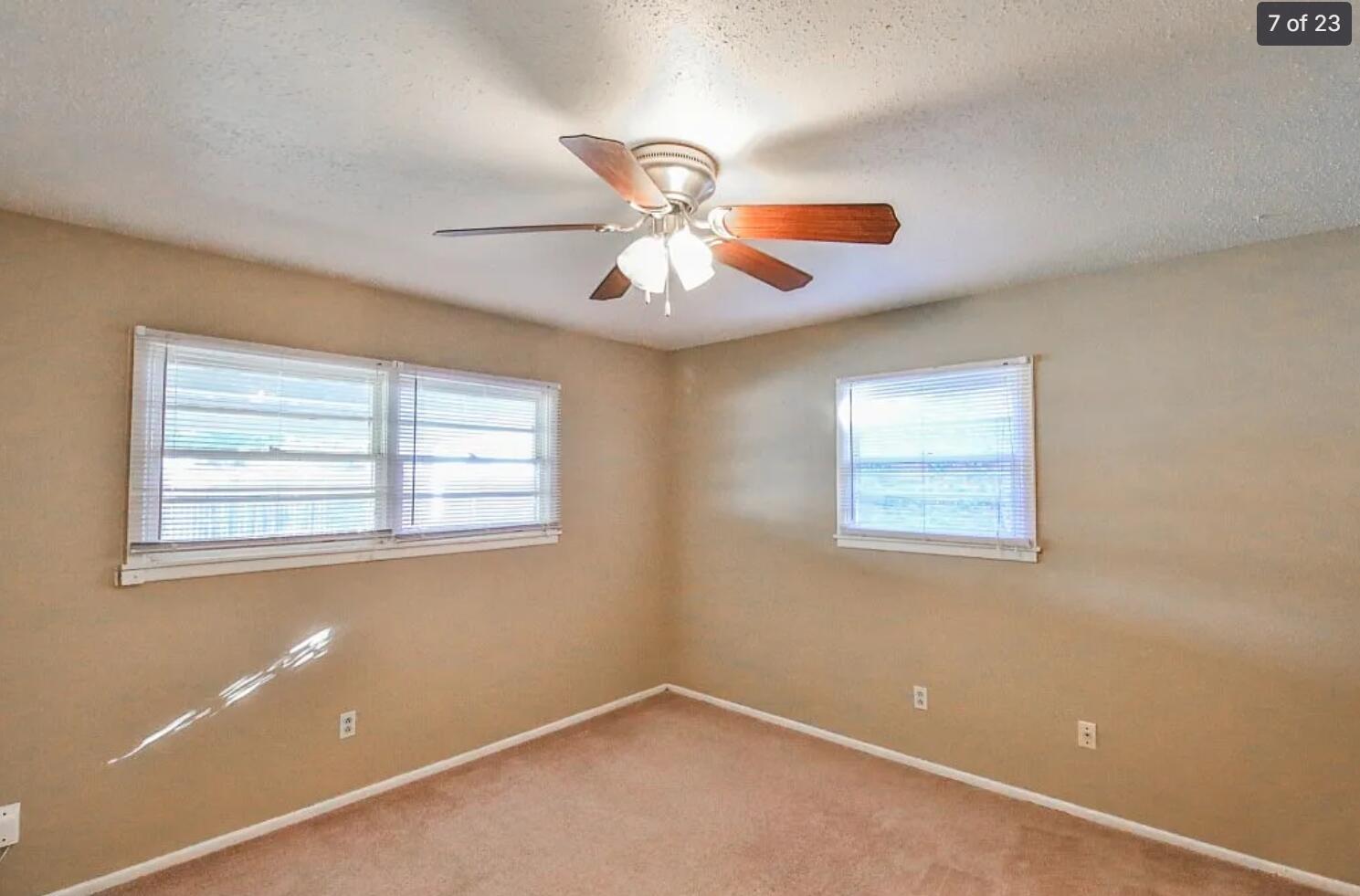 5426 33rd Street Lubbock, TX 79407 - Photo 16 of 27 a view of a room with a fan and a window