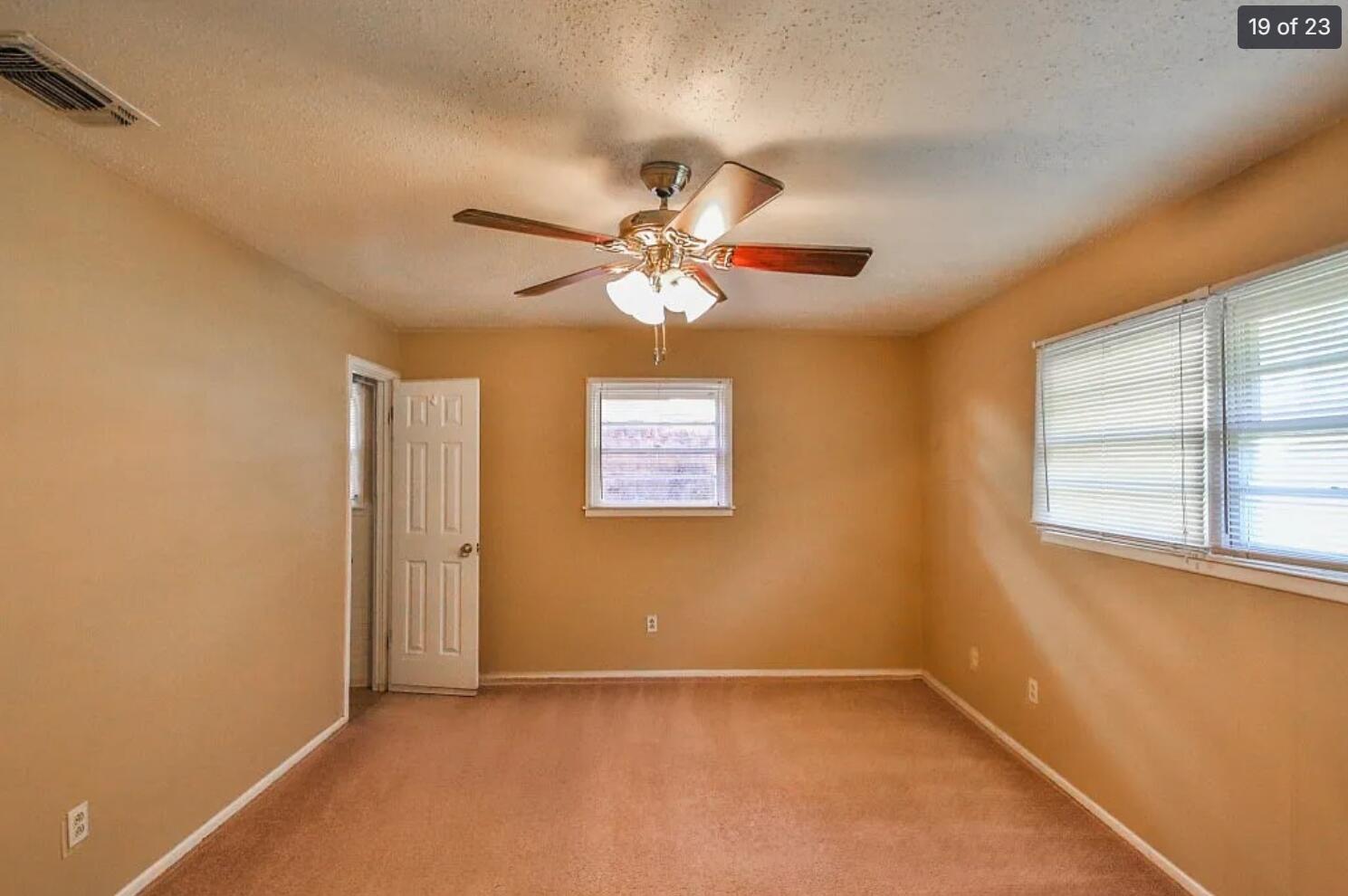 5426 33rd Street Lubbock, TX 79407 - Photo 18 of 27 a view of an empty room with a window