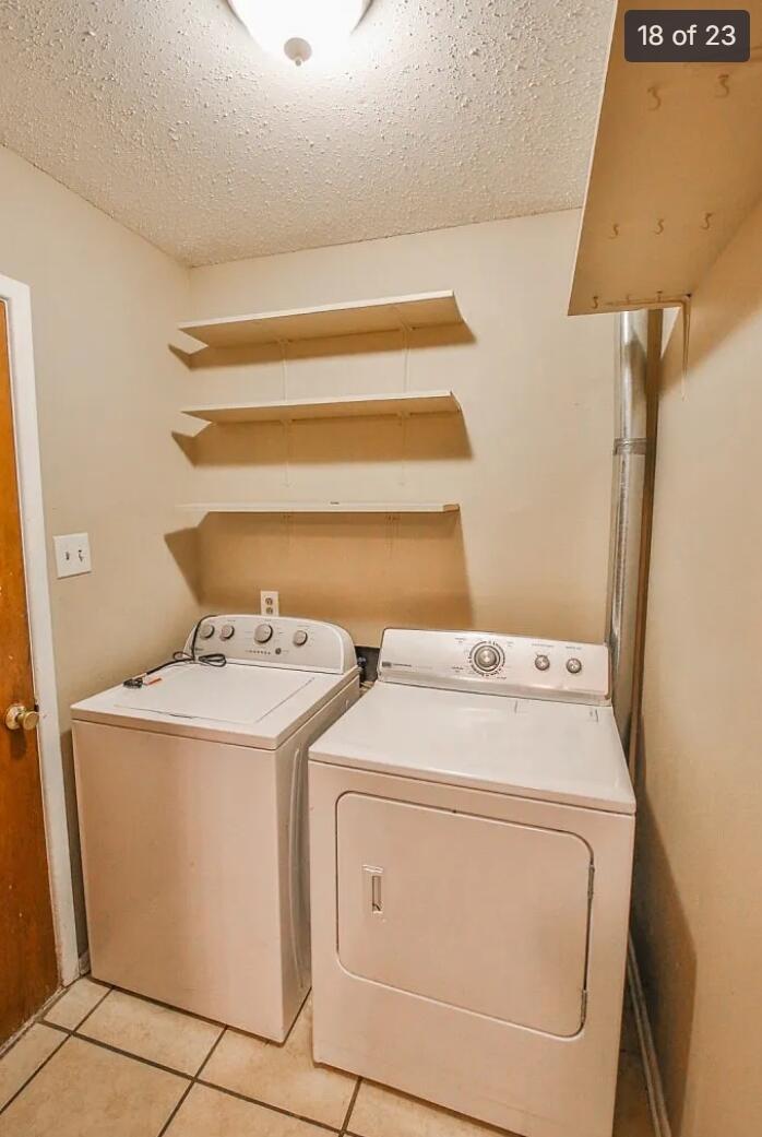 5426 33rd Street Lubbock, TX 79407 - Photo 22 of 27 a utility room with dryer and washer