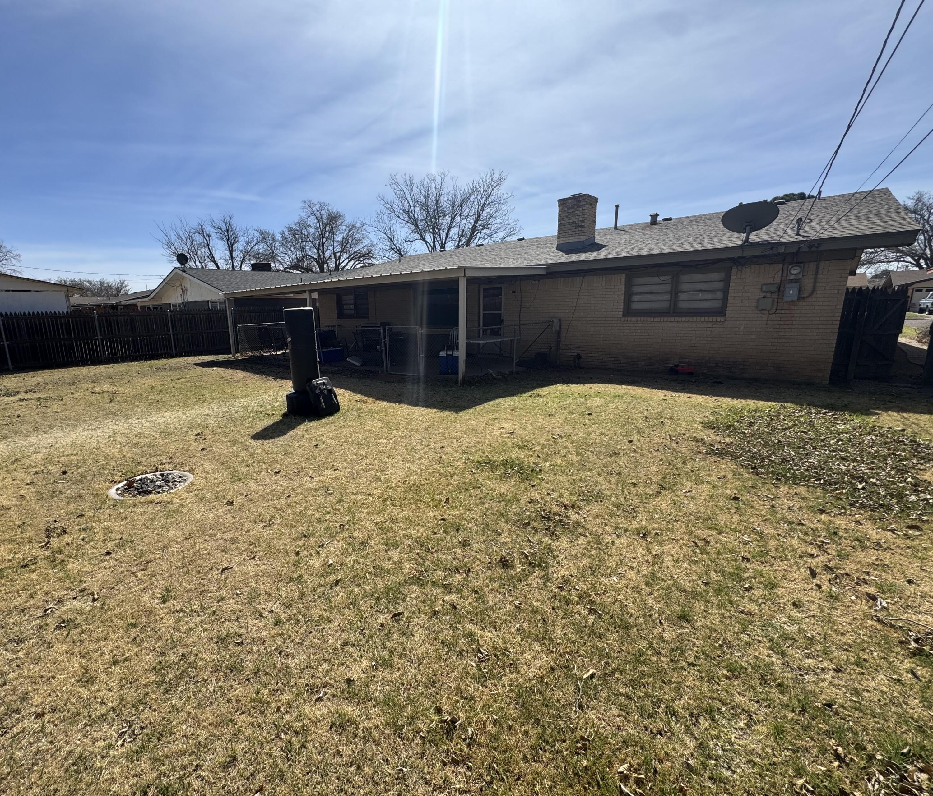 5426 33rd Street Lubbock, TX 79407 - Photo 25 of 27 a view of a backyard of the house
