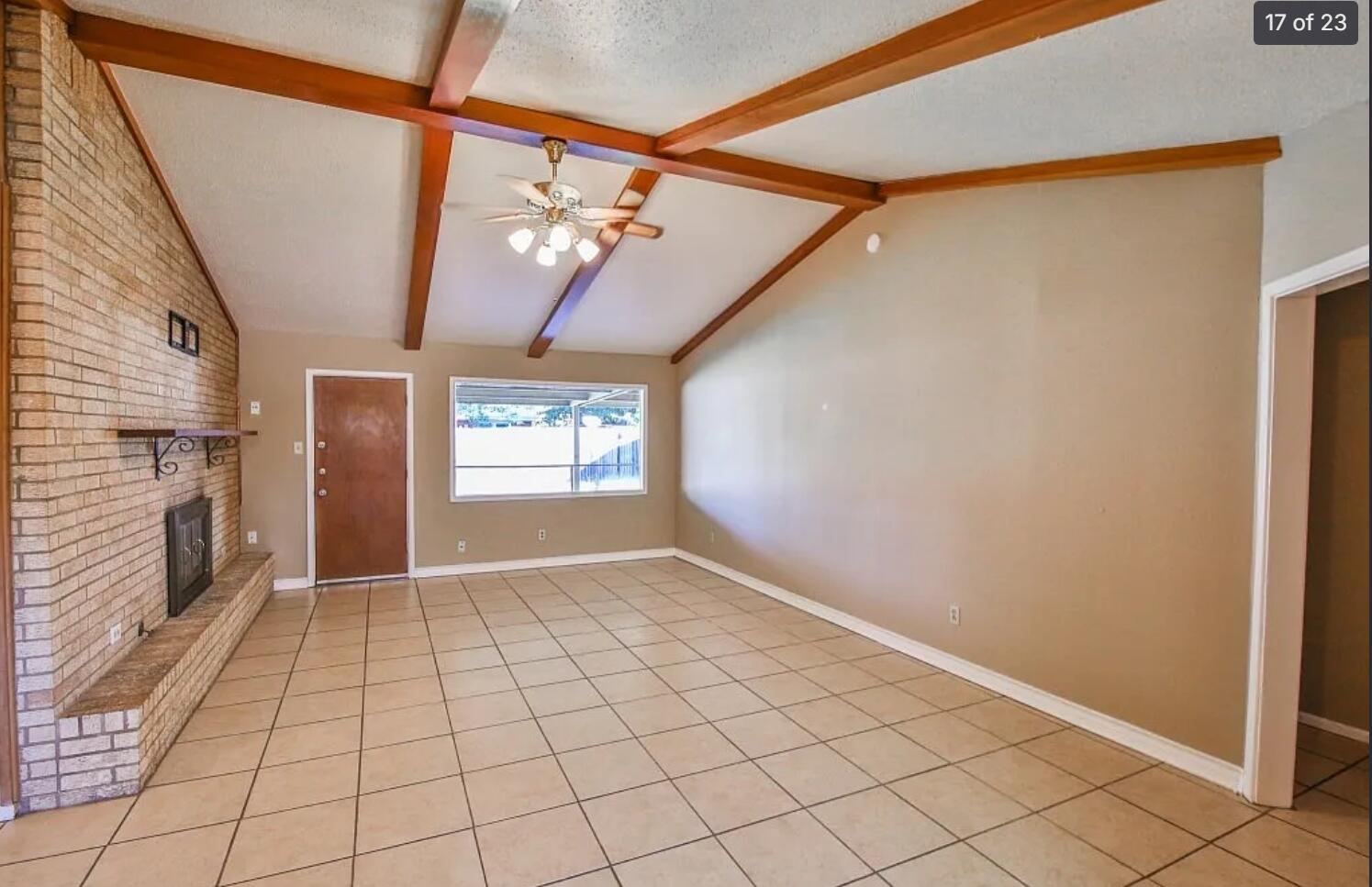 5426 33rd Street Lubbock, TX 79407 - Photo 5 of 27 a view of an empty room with a fireplace