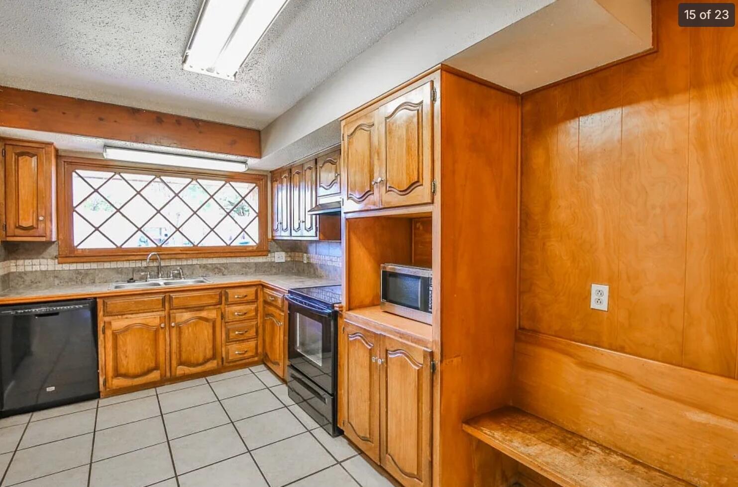 5426 33rd Street Lubbock, TX 79407 - Photo 8 of 27 a kitchen with stainless steel appliances granite countertop a refrigerator and a stove top oven