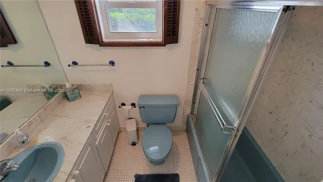 a bathroom with a toilet and a sink