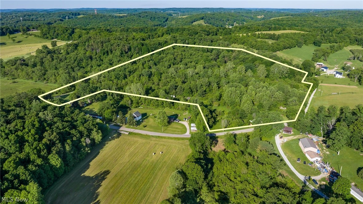 5911 Reform Road Northeast Newark, OH 43055 - Photo 18 of 19 Expansive wooded acreage with a defined boundary, featuring dense tree coverage and clearings