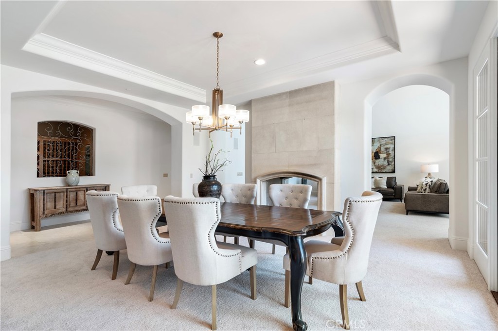 18090 Old Coach Drive Poway, CA 92064 - Photo 12 of 75 a dining room with furniture a chandelier and window