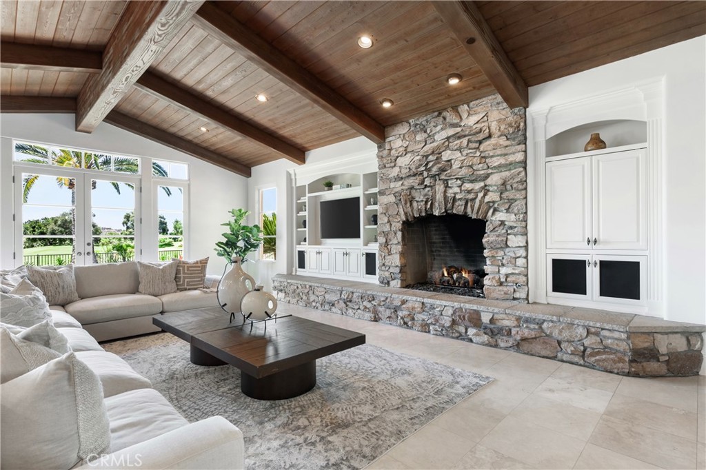 18090 Old Coach Drive Poway, CA 92064 - Photo 20 of 75 a living room with furniture a fireplace and a flat screen tv