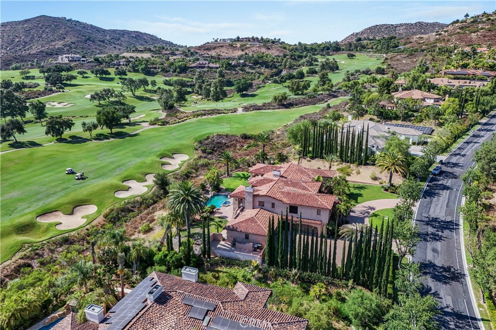 18090 Old Coach Drive Poway, CA 92064 - Photo 3 of 75 a view of a garden with a house