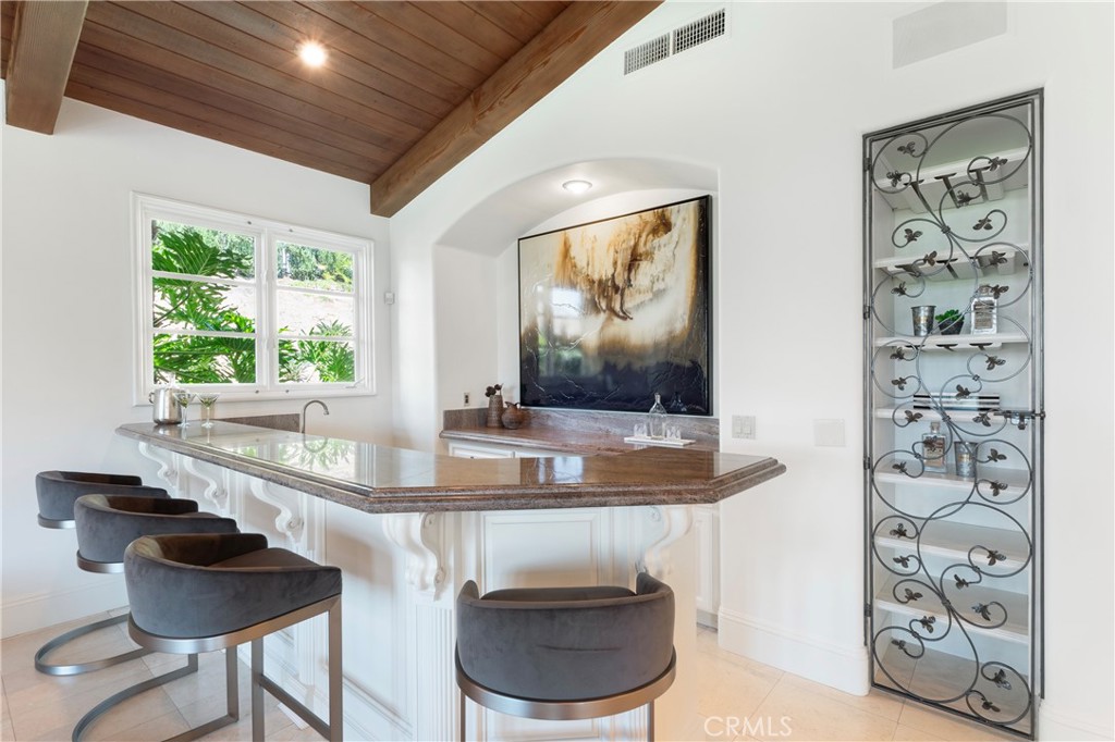 18090 Old Coach Drive Poway, CA 92064 - Photo 31 of 75 a kitchen with a table and chairs
