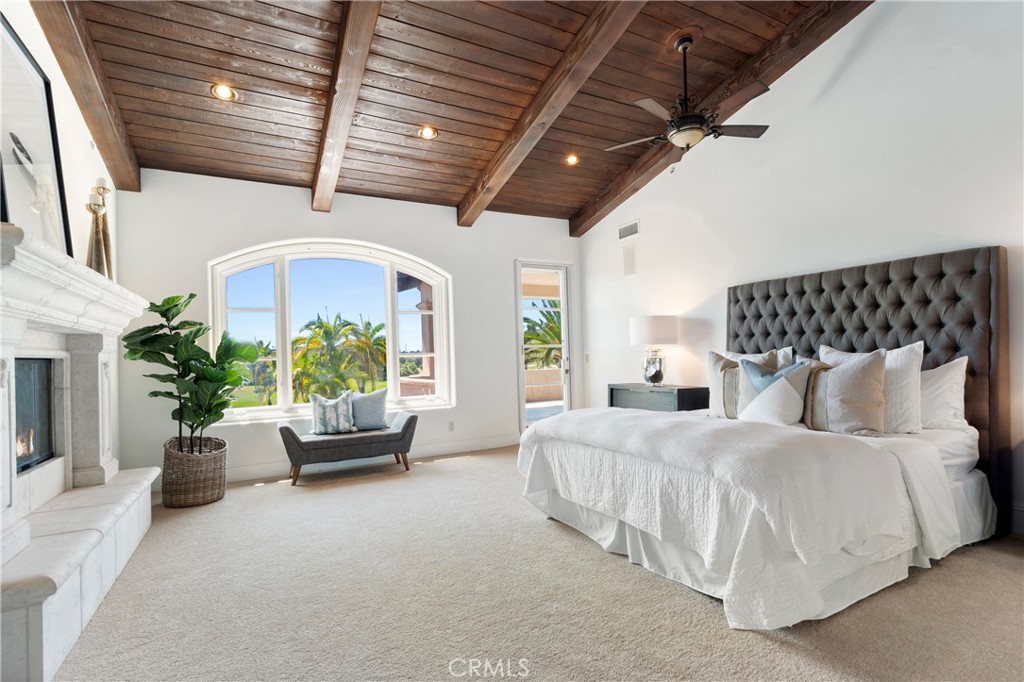 18090 Old Coach Drive Poway, CA 92064 - Photo 34 of 75 a spacious bedroom with a bed couch and potted plant