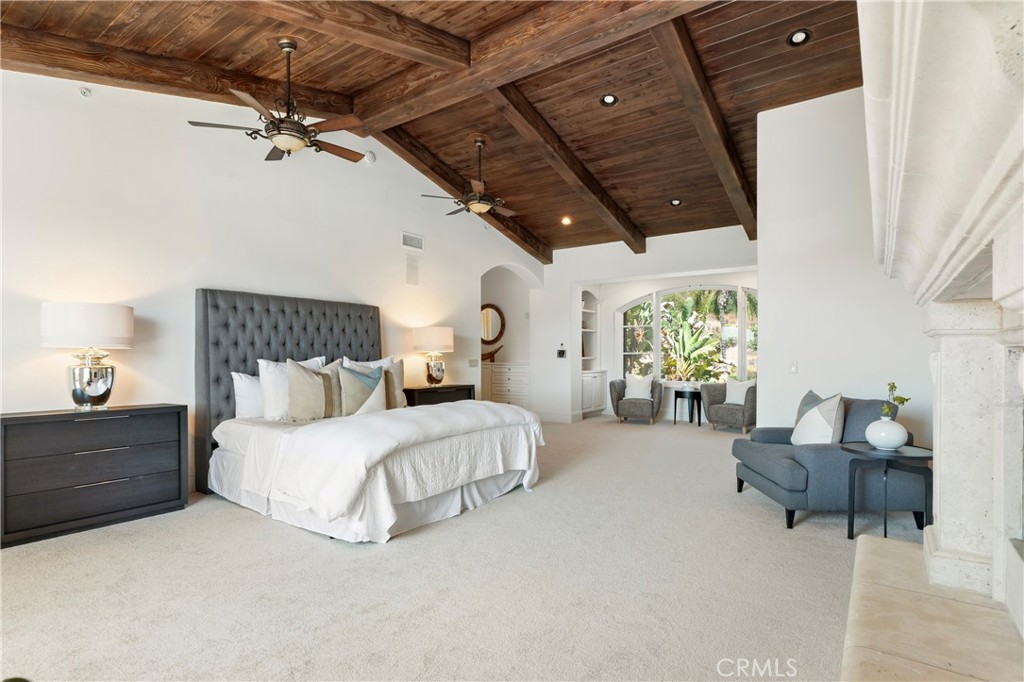 18090 Old Coach Drive Poway, CA 92064 - Photo 35 of 75 a spacious bedroom with a bed and a couch