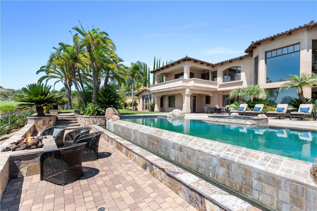 18090 Old Coach Drive Poway, CA 92064 - Photo 4 of 75 a view of swimming pool with outdoor seating and a pathway