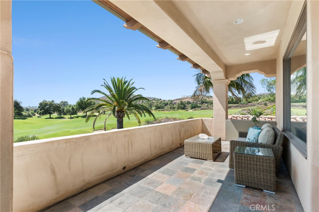 18090 Old Coach Drive Poway, CA 92064 - Photo 43 of 75 a balcony with table and chairs