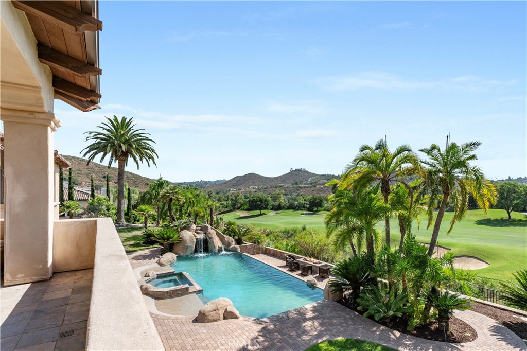 18090 Old Coach Drive Poway, CA 92064 - Photo 44 of 75 a view of a backyard with plants and lake view