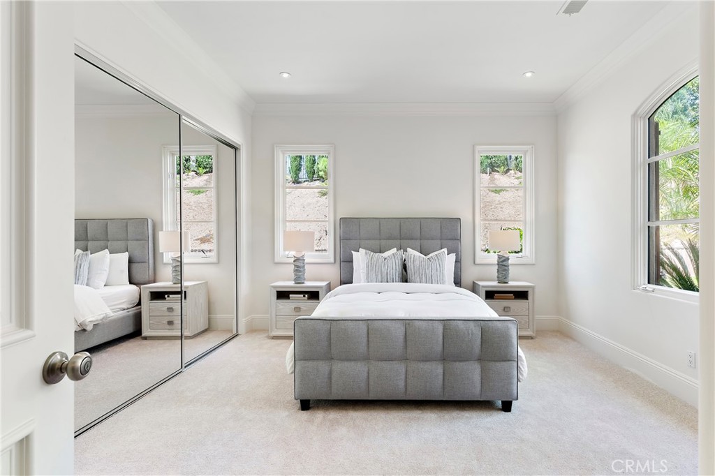 18090 Old Coach Drive Poway, CA 92064 - Photo 56 of 75 a bedroom with a bed and large window