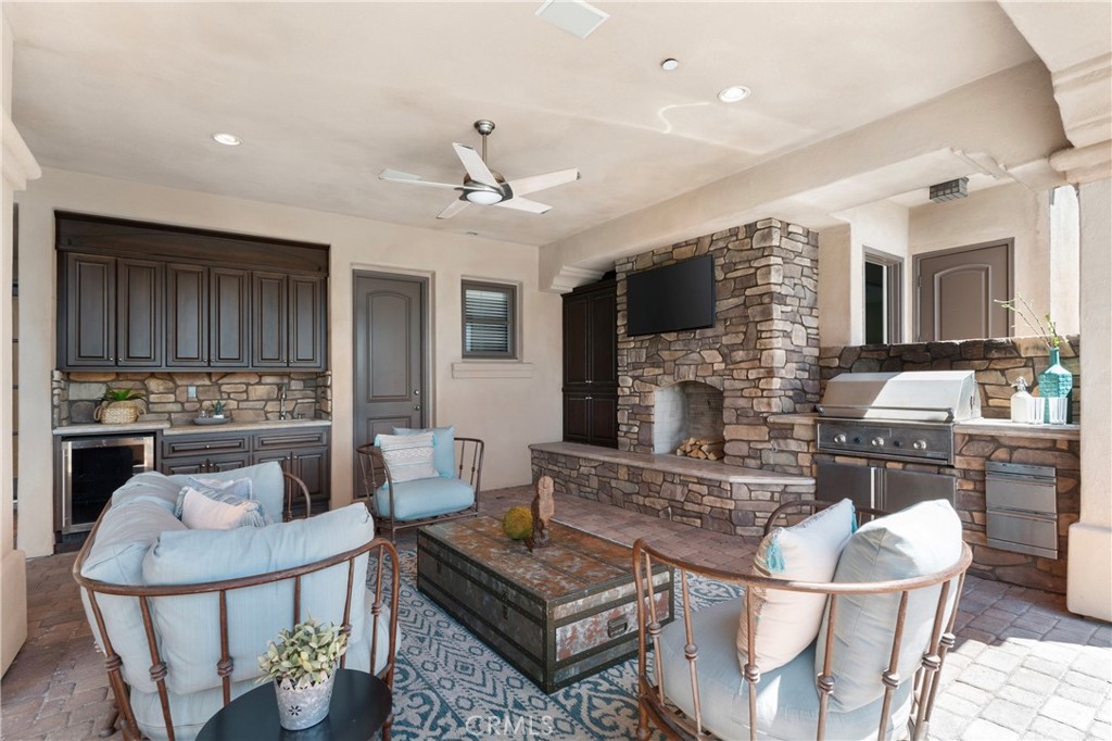 18090 Old Coach Drive Poway, CA 92064 - Photo 64 of 75 a living room with fireplace furniture and a flat screen tv