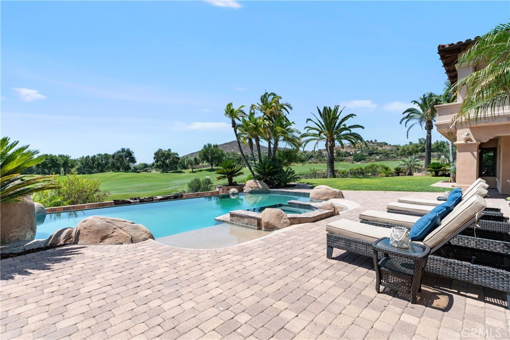 18090 Old Coach Drive Poway, CA 92064 - Photo 67 of 75 a view of swimming pool with outdoor seating and plants