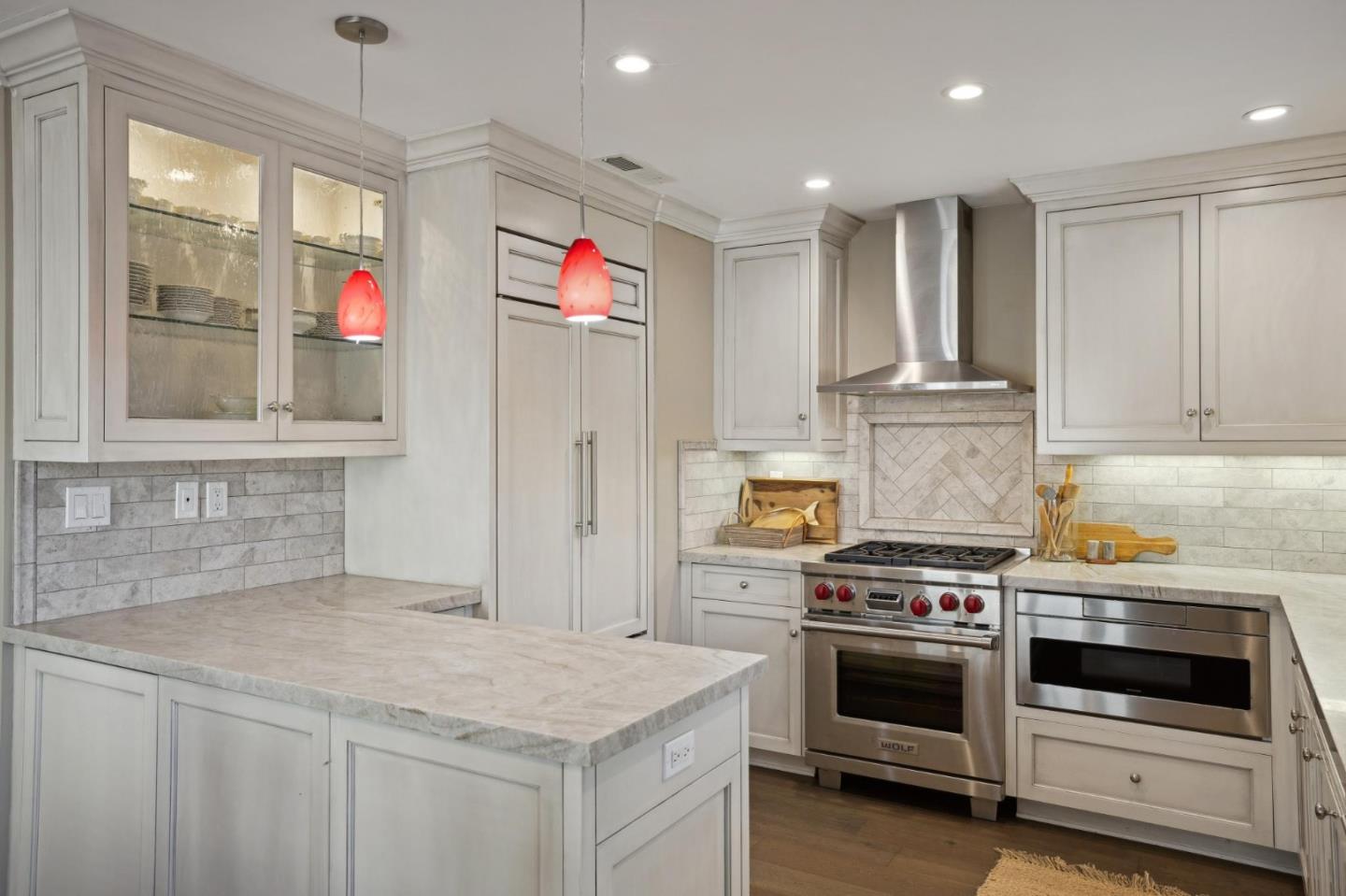3850 Rio Road, Unit 1 Carmel, CA 93923 - Photo 14 of 46 a kitchen that has a stove and a microwave