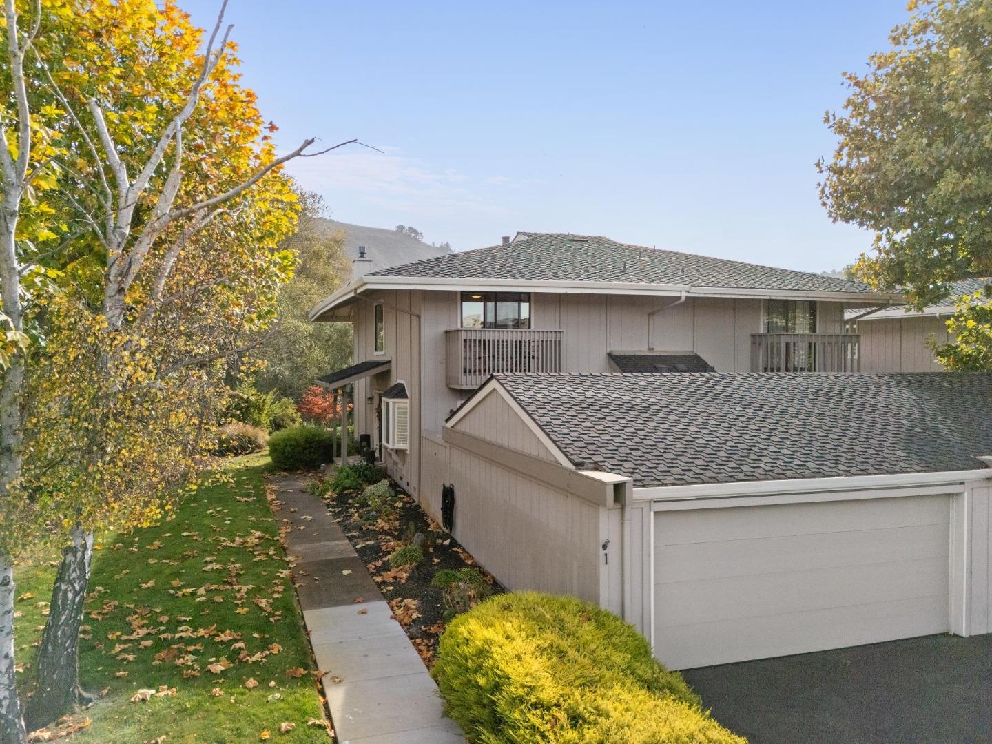 3850 Rio Road, Unit 1 Carmel, CA 93923 - Photo 2 of 46 a front view of a house with garden