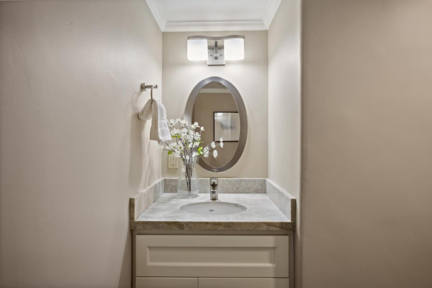 3850 Rio Road, Unit 1 Carmel, CA 93923 - Photo 21 of 46 a bathroom with a sink and a mirror
