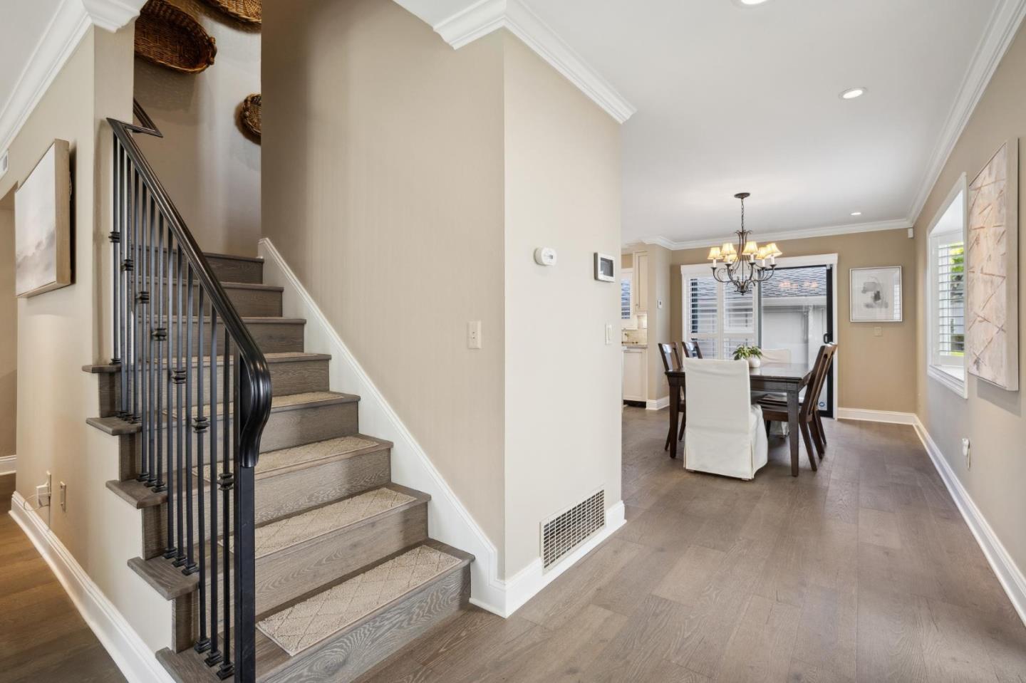 3850 Rio Road, Unit 1 Carmel, CA 93923 - Photo 22 of 46 a view of a room with lots of frames and flower potted plants