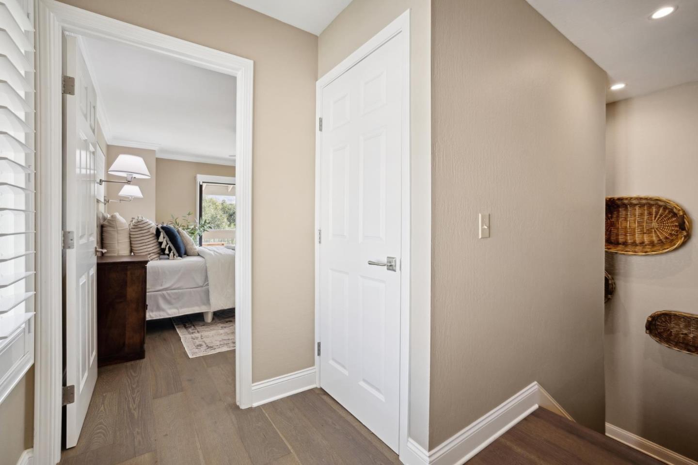 3850 Rio Road, Unit 1 Carmel, CA 93923 - Photo 23 of 46 a view of a bedroom from a hallway