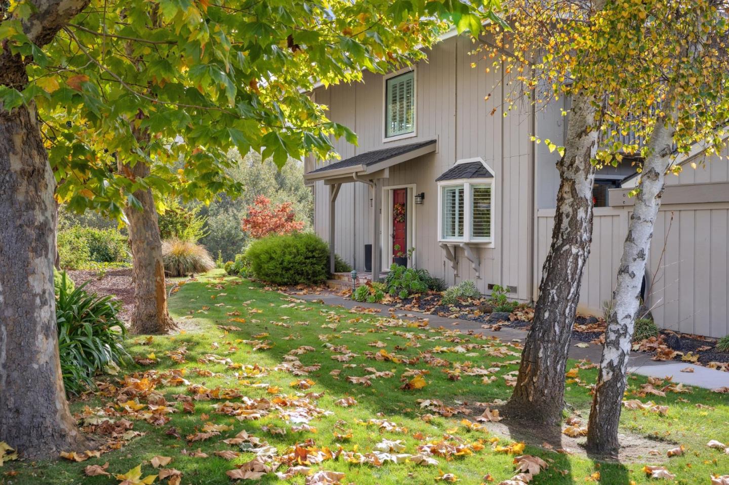 3850 Rio Road, Unit 1 Carmel, CA 93923 - Photo 3 of 46 a front view of a house with garden
