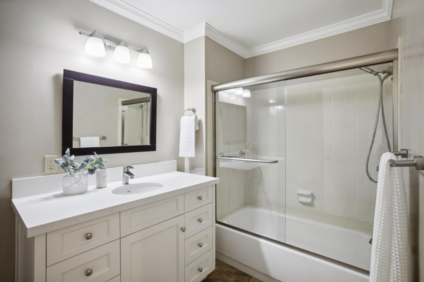 3850 Rio Road, Unit 1 Carmel, CA 93923 - Photo 35 of 46 a bathroom with a double vanity sink mirror double and shower