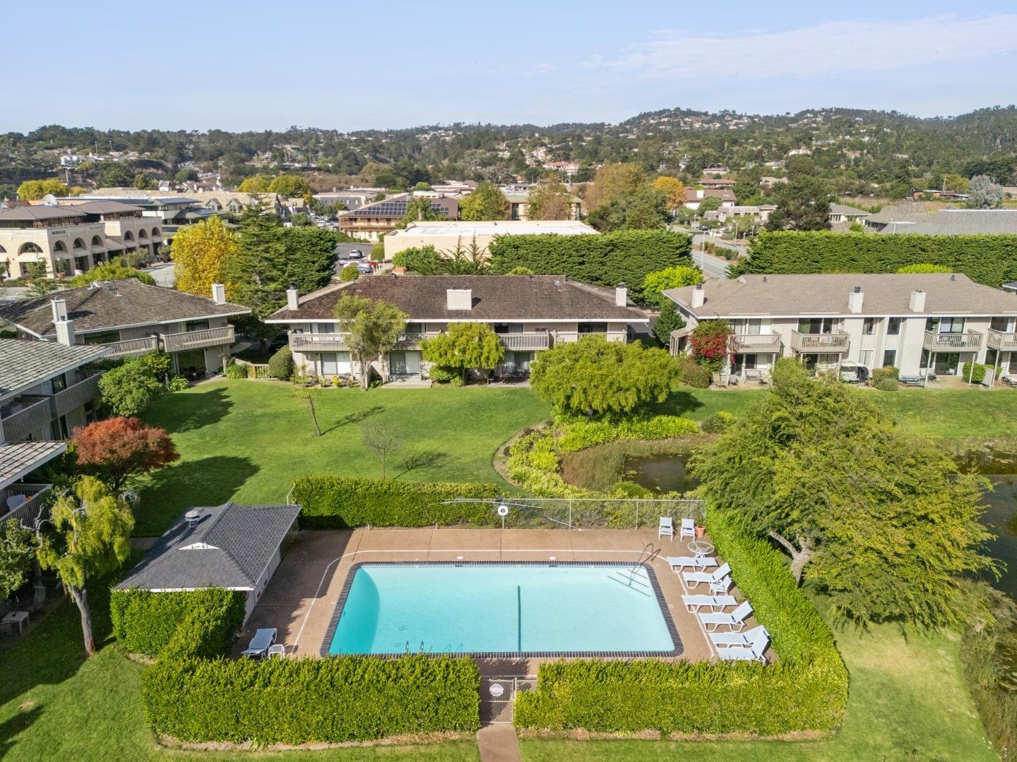 3850 Rio Road, Unit 1 Carmel, CA 93923 - Photo 44 of 46 an aerial view of residential houses with outdoor space and trees