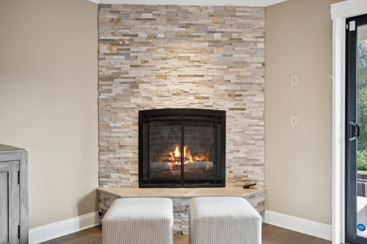 3850 Rio Road, Unit 1 Carmel, CA 93923 - Photo 9 of 46 a living room with a fireplace and a fireplace